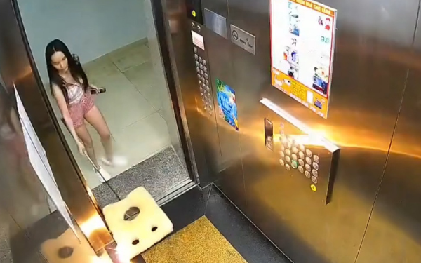 Woman burns piece of foam and throws it into apartment elevator